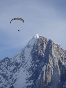 Paraglider in front of the Dru